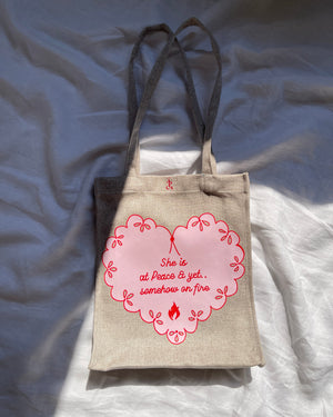 She is at peace and yet somehow on fire tote bag