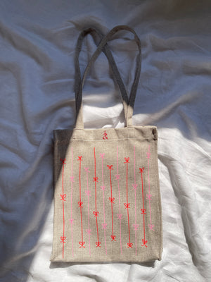 Fallen ribbon tote bag