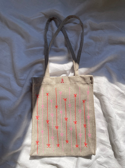 Fallen ribbon tote bag